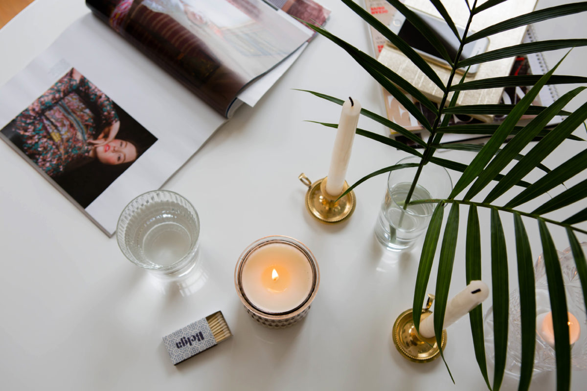 Ashley Kane dining room tour white table san francisco apartment cane cantilever chair black and gold chandelier
